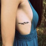 Tattoo on ribs of girls photo