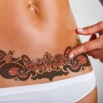 Tattoo on the belly for girls photo