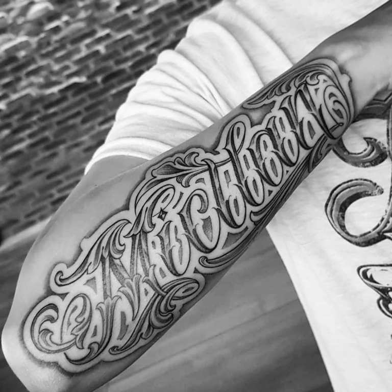Tattoo inscriptions on the arm