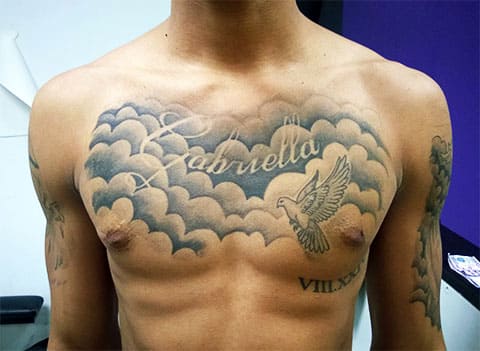 Tattoo sky and clouds on his chest