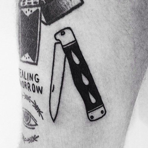 Tattoo bowie knife. Photo, meaning, sketches of the rose, the inscription, a spider's web