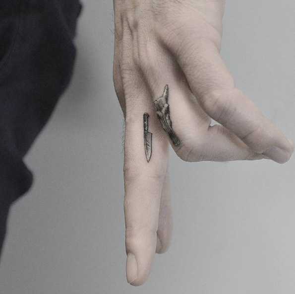 Tattoo of a knife on your finger