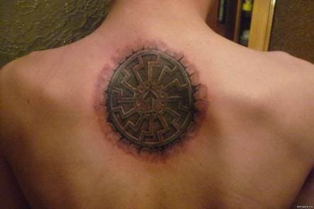 tattoo amulet on his back