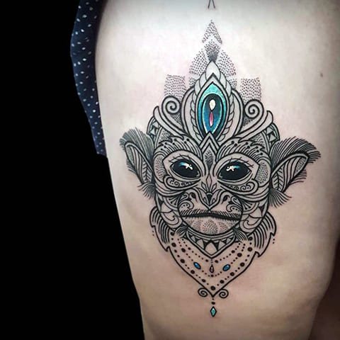 Tattoo monkey on girl's thigh