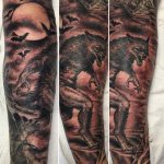 Tattoo of werewolf on guy's leg