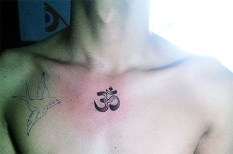 Tattoo Om on a Boy's Chest