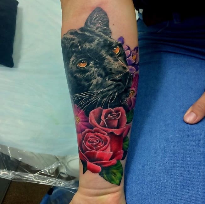 Panther tattoo with flowers