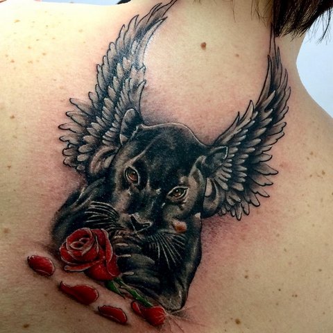Panther tattoo with a rose and wings on his back