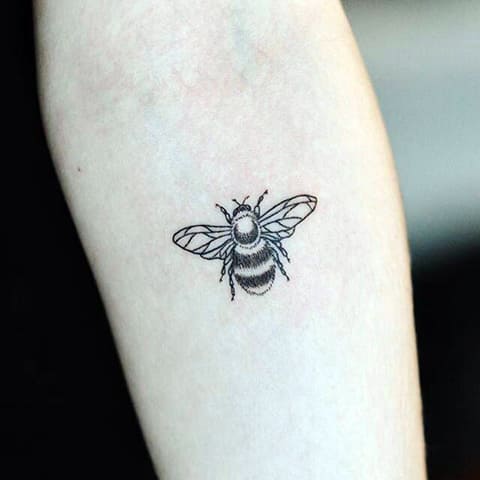 Tattoo bee on forearm