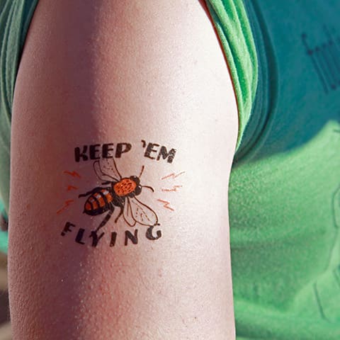 Tattoo a bee and caption