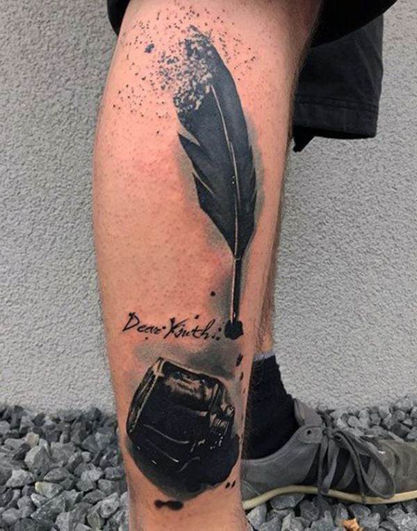 Tattoo of a feather on his leg