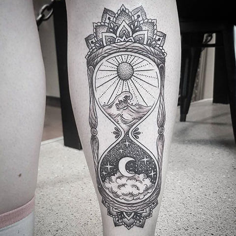 Tattoo of an hourglass on a leg
