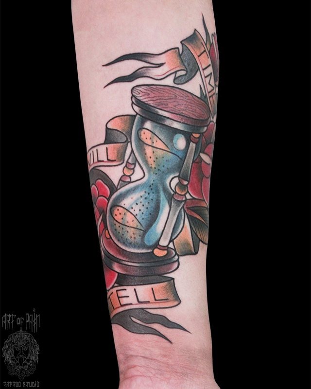 Hourglass tattoo on arm by Art of Pain