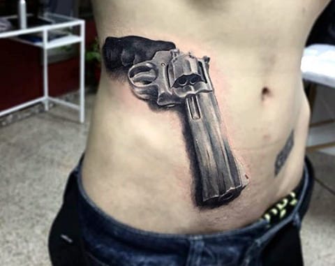 Tattoo a gun on a man's side