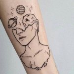 Tattoo of planets on hand
