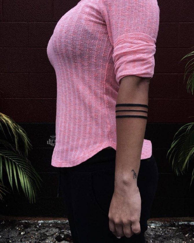 Tattoo stripes around the arm