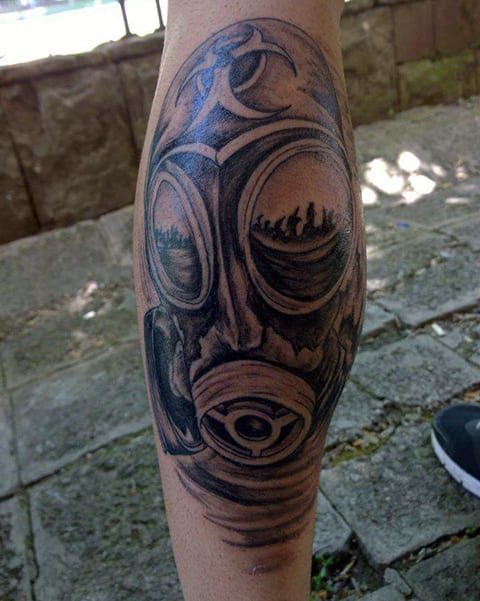 Gas mask tattoo on his leg