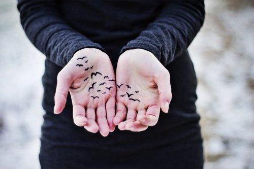 Tattoo of birds on hand for girls