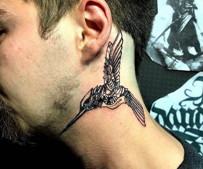 Tattoo-bird on a man's neck