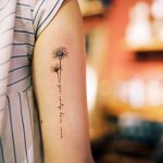 Tattoo of daisy on a girl's arm
