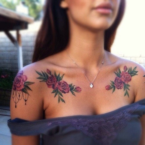 Tattoo roses over breasts