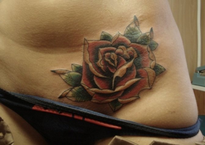 Tattoo of a rose on a woman's crotch
