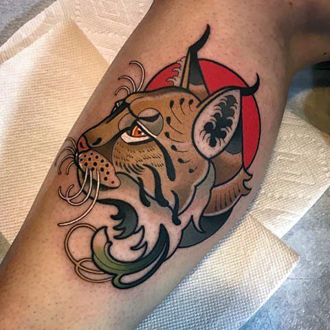 Tattoo of a lynx on his leg