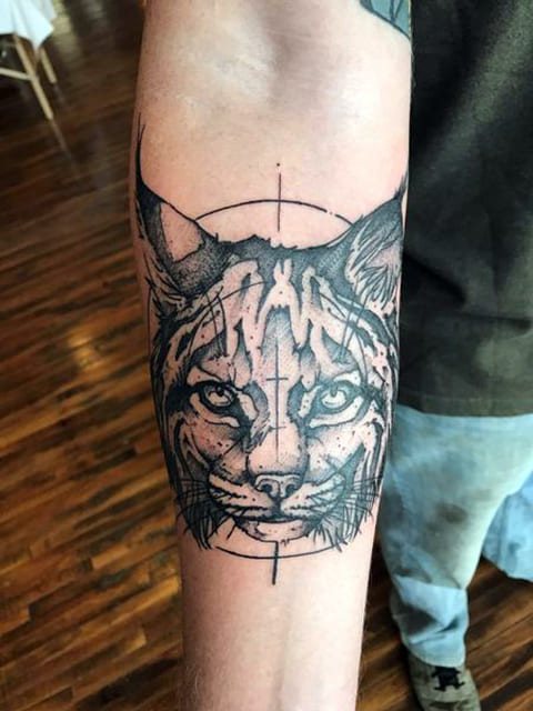 Lynx tattoo on forearm