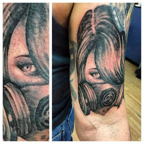 Tattoo girl with a gas mask