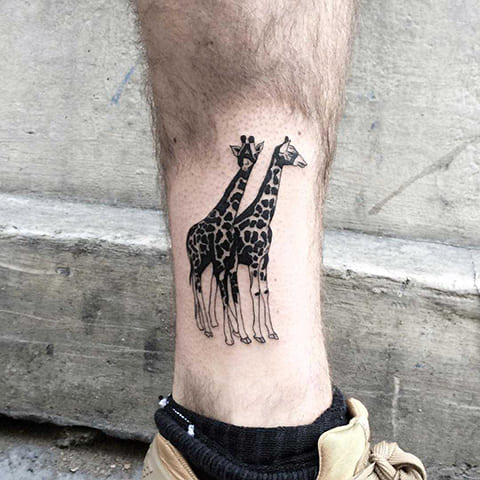 Tattoo with two giraffes