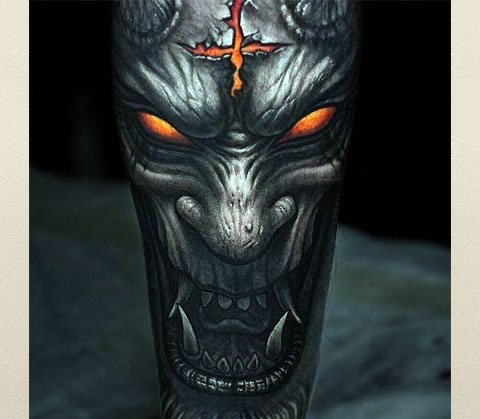 Tattoo with head of demon