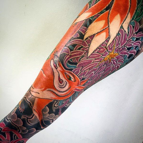 Tattoo with kitsune and peonies