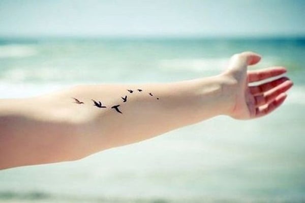 Tattoo with flying birds