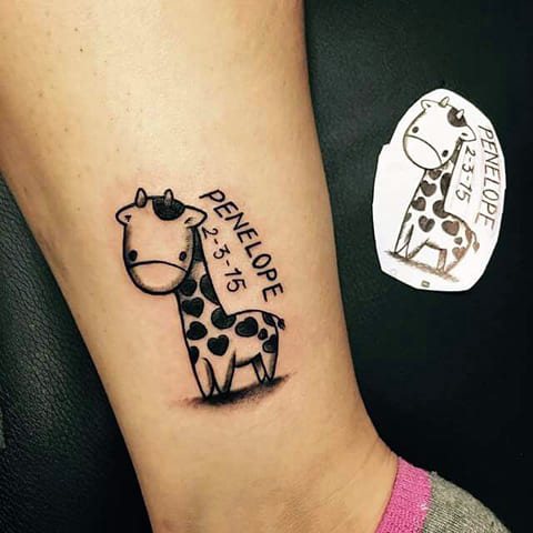 Tattoo with a petite giraffe