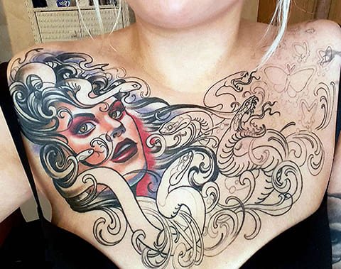 Tattoo of Medusa Gorgon on chest