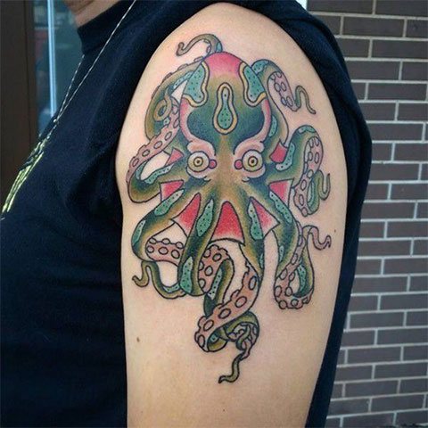 Tattoo of octopus on hand - photo