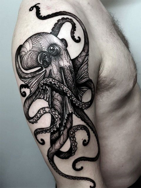 Tattoo of octopus on hand