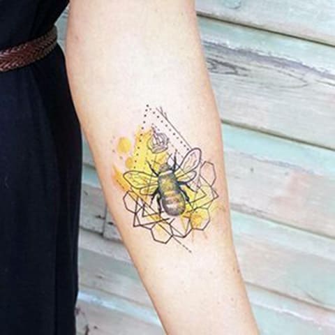 Tattoo with a bee and honeycomb