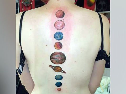 Tattoo with planets on back - photo
