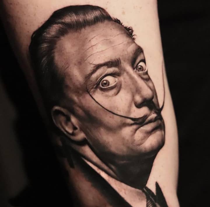 Tattoo with the portrait of Salvador Dali realism