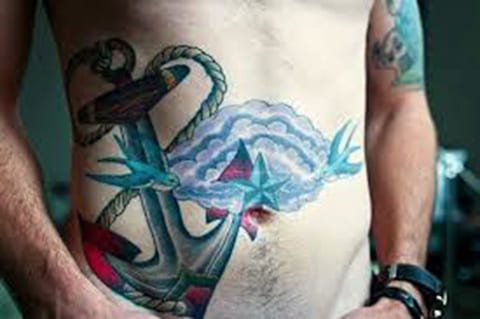 Anchor tattoo on male stomach - photo