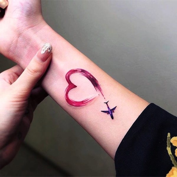 Heart tattoo on the wrist, hand, face, chest. Sketch, meaning