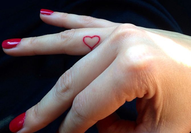 Tattoo of a heart on your finger. Meaning, what it means, sketches, photos
