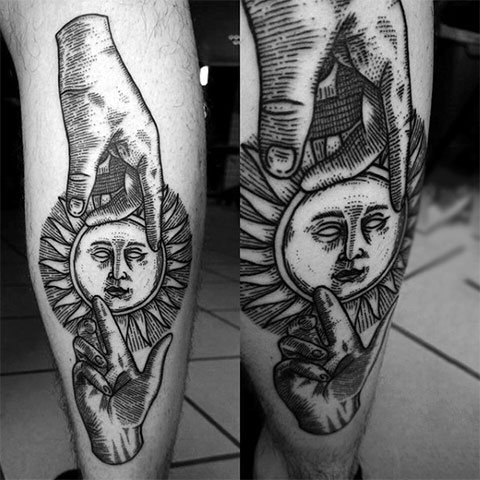 Tattoo sun on his leg
