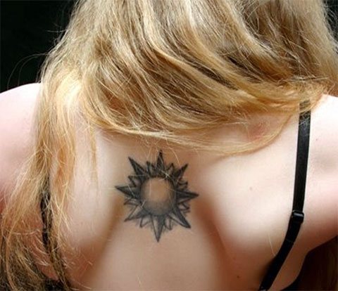 Tattoo sun on a girl's back
