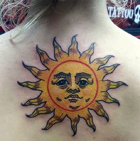 Tattoo sun on back