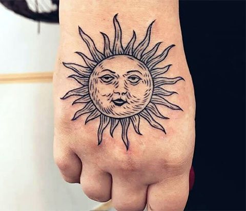 Tattoo sun on wrist