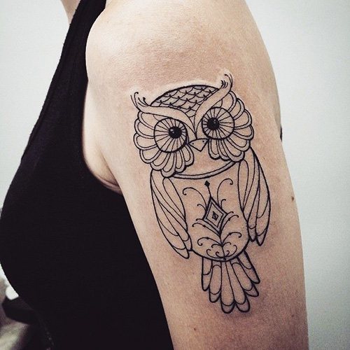 Tattoo of an owl on the arm for girls. Photos, meaning, sketches