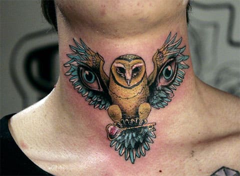 Tattoo of an owl on his neck