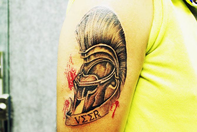 Spartan helmet tattoo. Meaning, sketches, photos